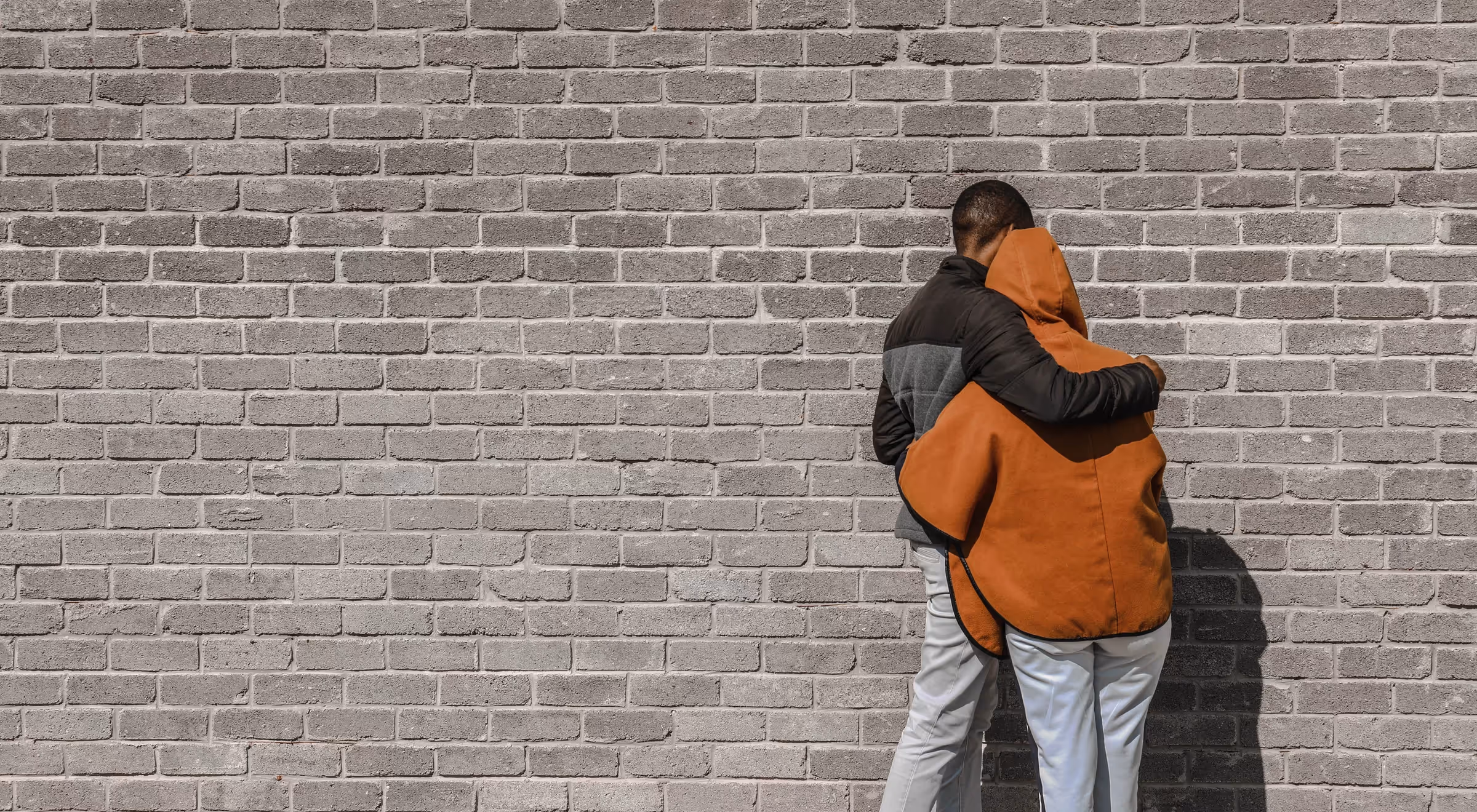 A couple hugs after forgiving each other.
